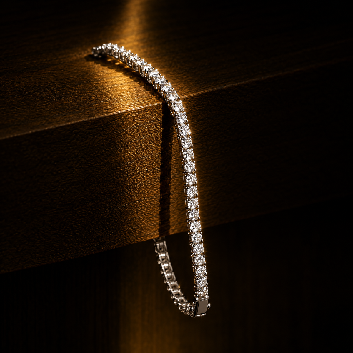 Iced out tennis bracelet draped over a wooden shelf in warm light