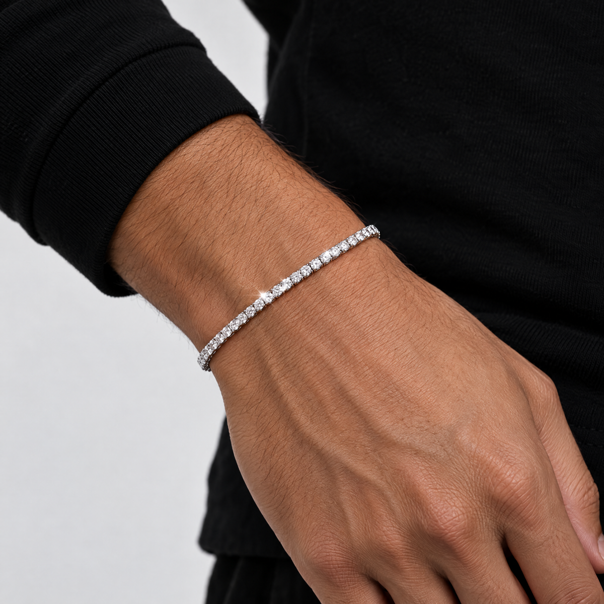 3mm VVS tennis bracelet worn on the wrist with a black long-sleeve