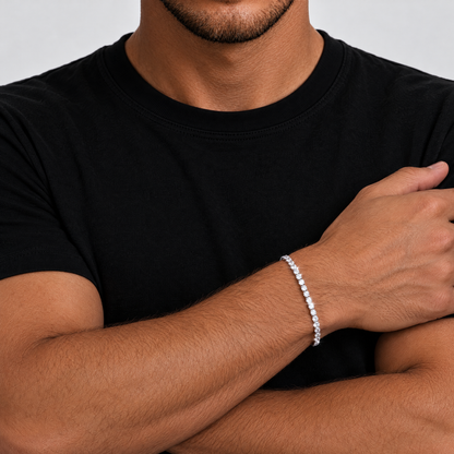 Man with arms crossed wearing the iced out tennis bracelet